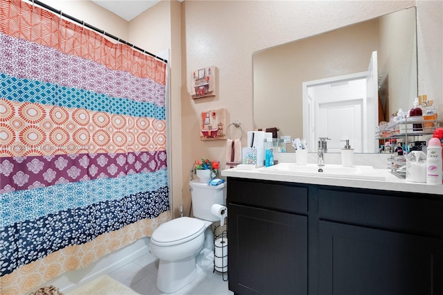 bathroom with toilet, tile patterned flooring, and vanity