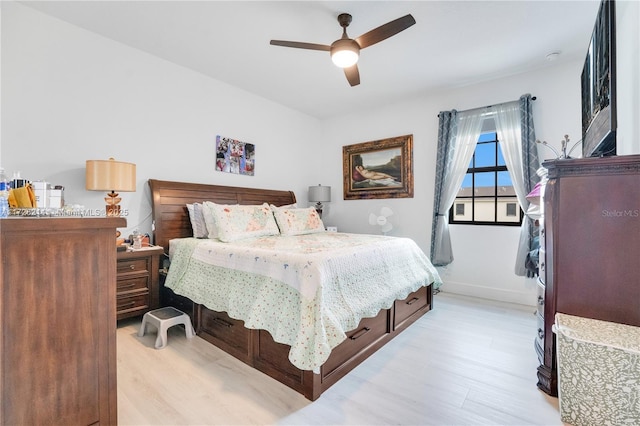 bedroom with ceiling fan and light hardwood / wood-style flooring