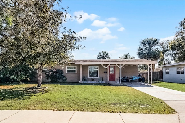 view of front of home featuring a front lawn and a carport