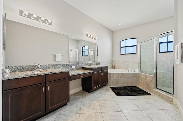 bathroom featuring tile patterned flooring, vanity, and separate shower and tub