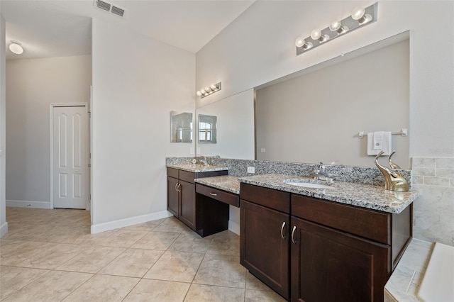 bathroom with vanity and tile patterned floors