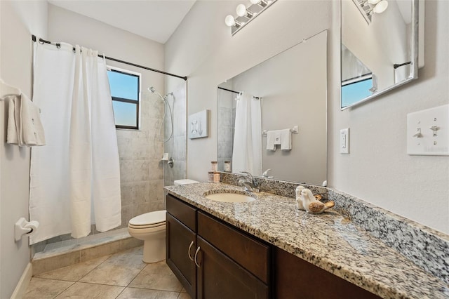 bathroom with vanity, a shower with shower curtain, tile patterned floors, and toilet