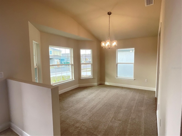 carpeted empty room with vaulted ceiling and a chandelier