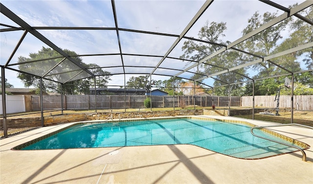 view of pool with a lanai and a patio