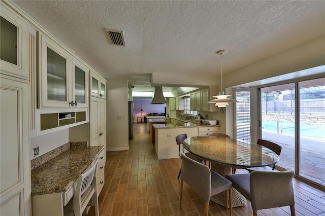 dining space featuring a textured ceiling