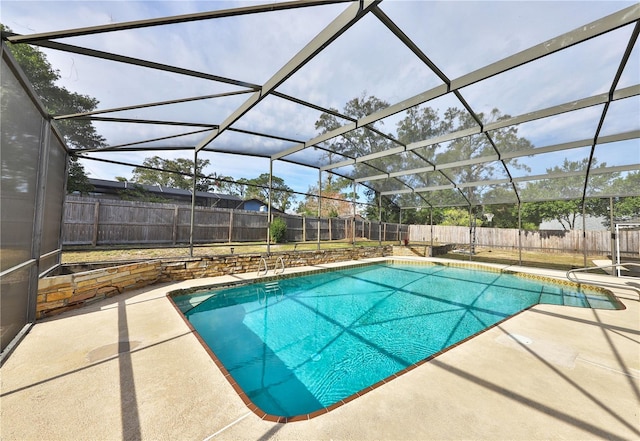 view of pool with a lanai and a patio area