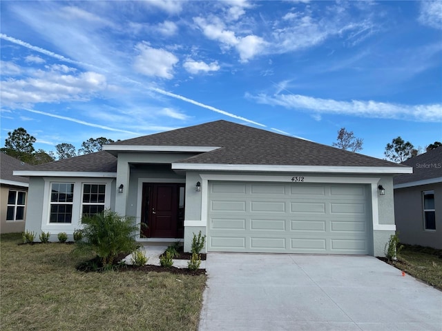 ranch-style home with a front yard and a garage