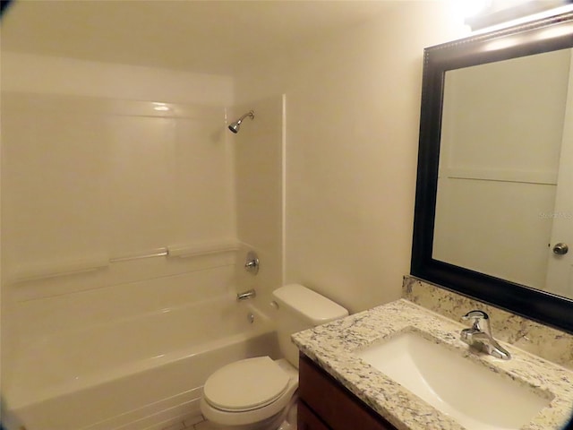 full bathroom featuring toilet, bathing tub / shower combination, and vanity