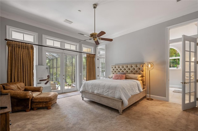 carpeted bedroom featuring ceiling fan, crown molding, french doors, and access to outside