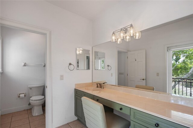 bathroom with tile patterned floors, vanity, and toilet