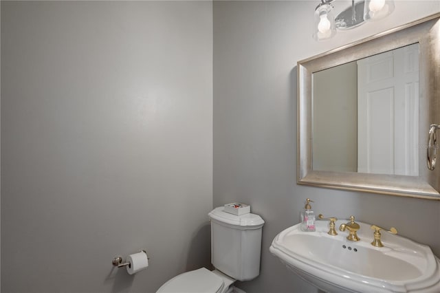 bathroom featuring sink and toilet