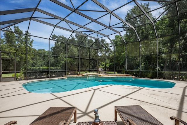 view of swimming pool with a lanai, a patio, and an in ground hot tub