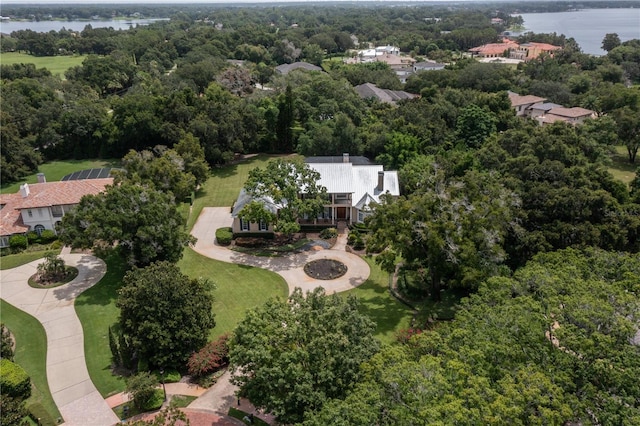 birds eye view of property with a water view