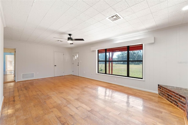 spare room with ceiling fan and light hardwood / wood-style floors