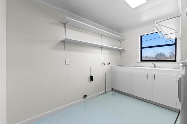 clothes washing area featuring cabinets, washer hookup, sink, and hookup for an electric dryer