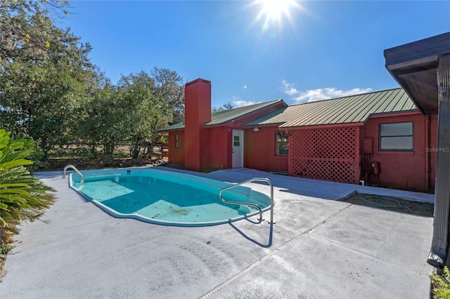 view of pool featuring a patio area