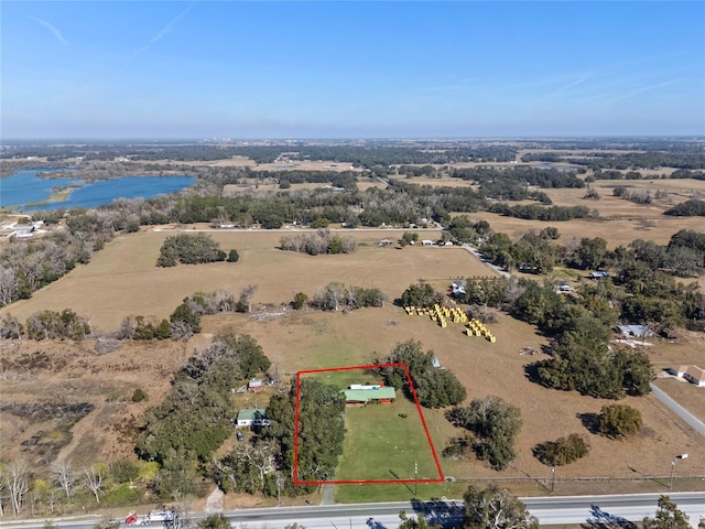 aerial view with a rural view and a water view