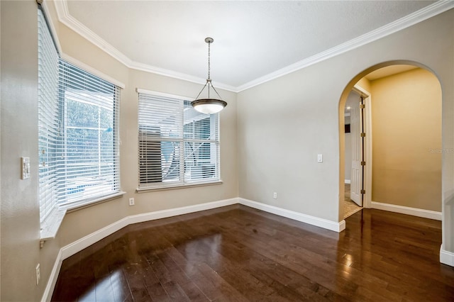 unfurnished dining area with plenty of natural light, dark wood-type flooring, and ornamental molding