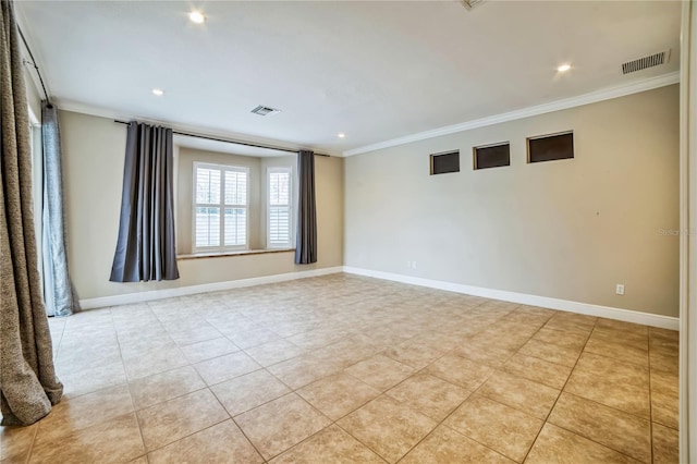 tiled empty room featuring crown molding