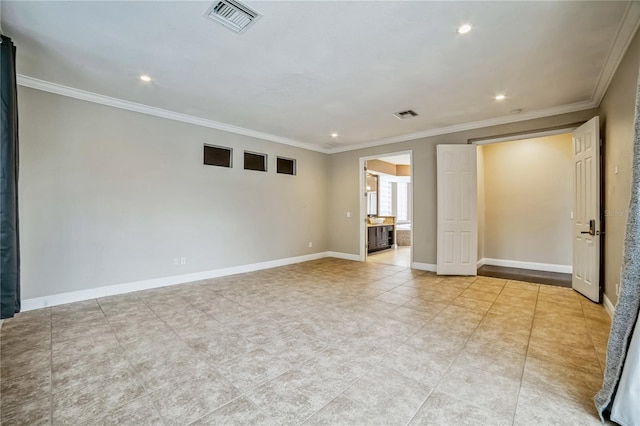 spare room with crown molding