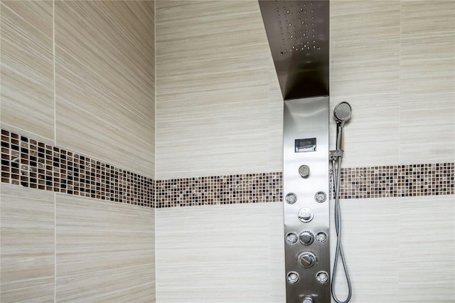 bathroom with a tile shower