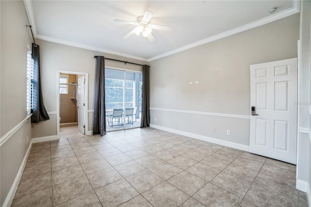 spare room with ceiling fan, ornamental molding, and light tile patterned flooring