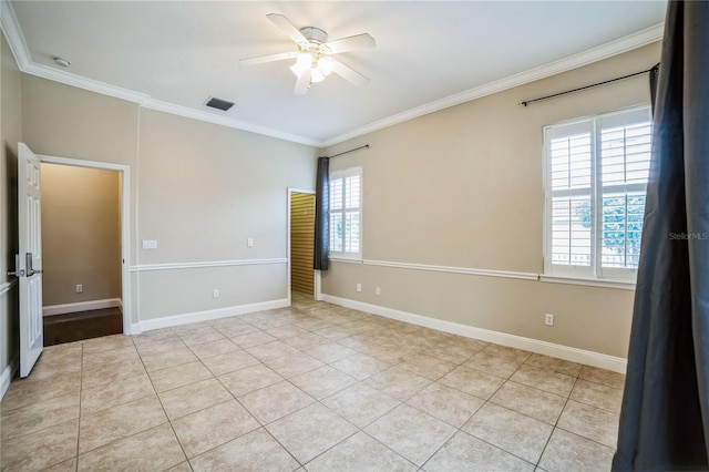 tiled spare room with ceiling fan and crown molding