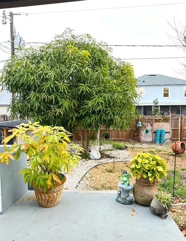 view of yard featuring a patio area and fence