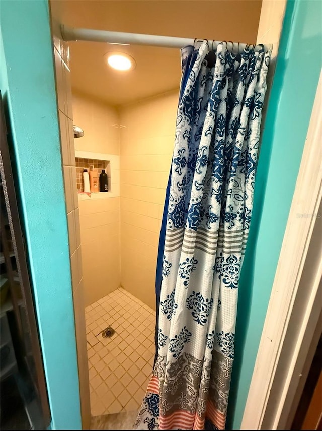 full bathroom featuring a shower stall