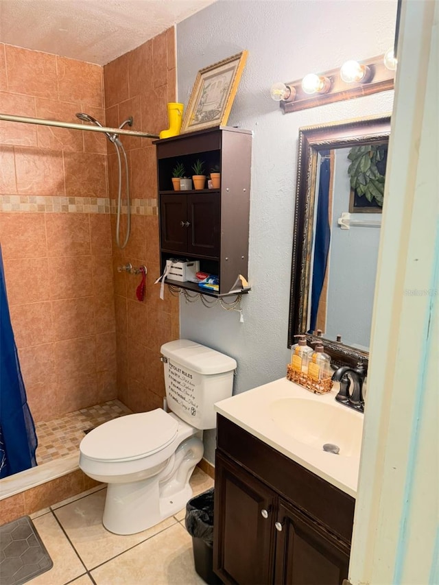 bathroom featuring tile patterned flooring, a shower stall, toilet, and vanity