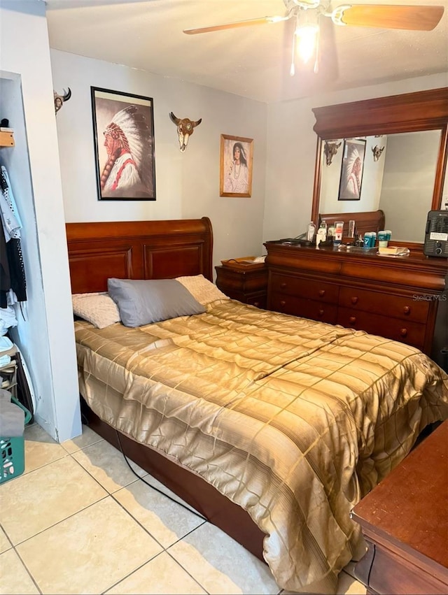 bedroom with light tile patterned floors and a ceiling fan