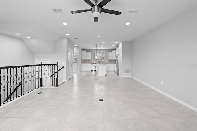 hall with light tile patterned floors