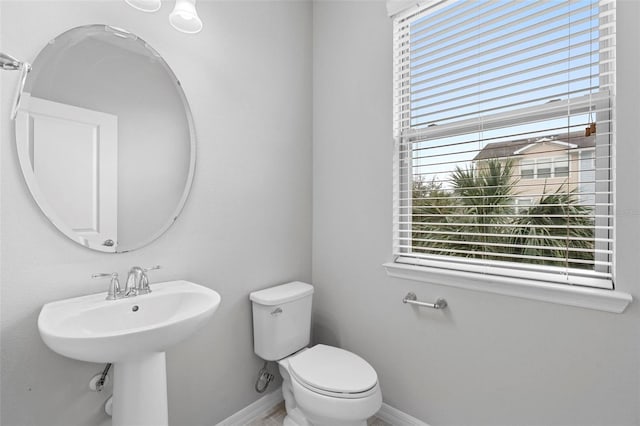 bathroom featuring toilet and sink