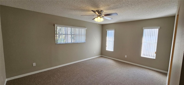 empty room featuring a textured ceiling, ceiling fan, and carpet flooring