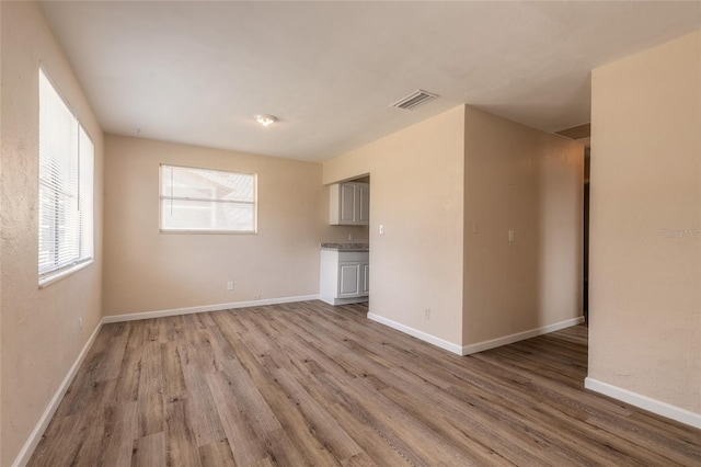 unfurnished living room with light hardwood / wood-style floors