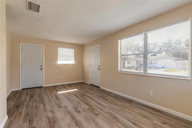 foyer entrance featuring hardwood / wood-style floors