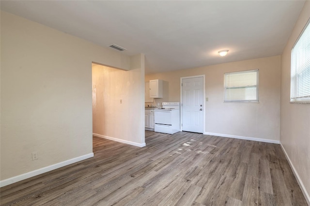 unfurnished living room featuring light hardwood / wood-style floors