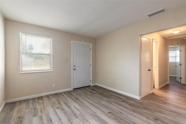 empty room with light wood-type flooring