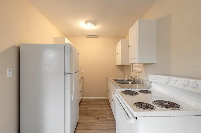 kitchen with sink, white cabinets, white appliances, and light wood-type flooring