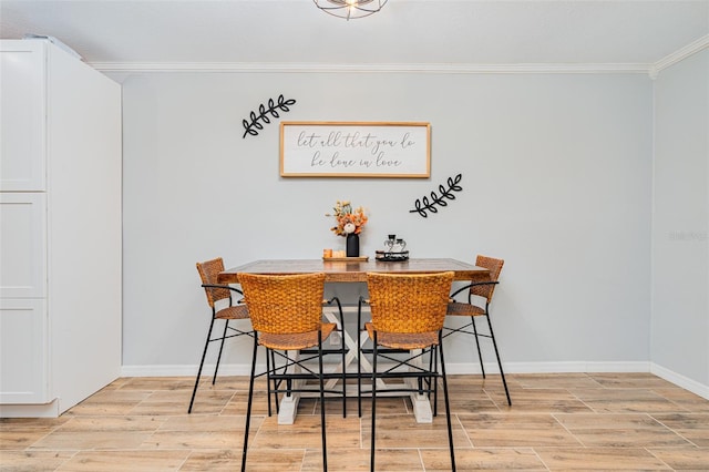 dining space with crown molding