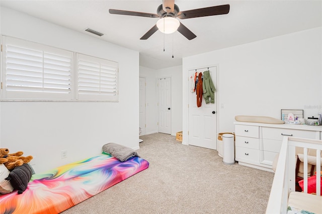 carpeted bedroom featuring ceiling fan