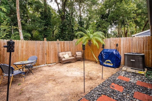 view of patio / terrace with a grill and central AC