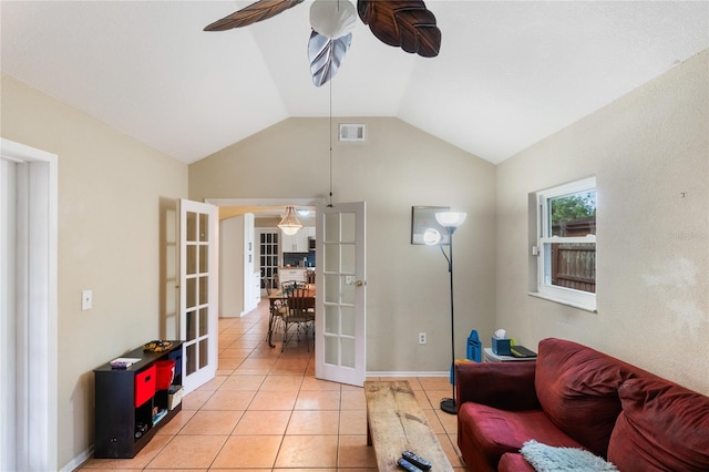 1309 Paradise Ln, Winter Park, FL 32792 - living room with vaulted ceiling, french doors, ceiling fan, and light tile patterned floors