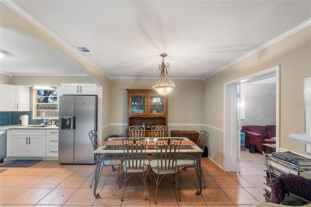 1309 Paradise Ln, Winter Park, FL 32792 - tiled dining space featuring sink and crown molding