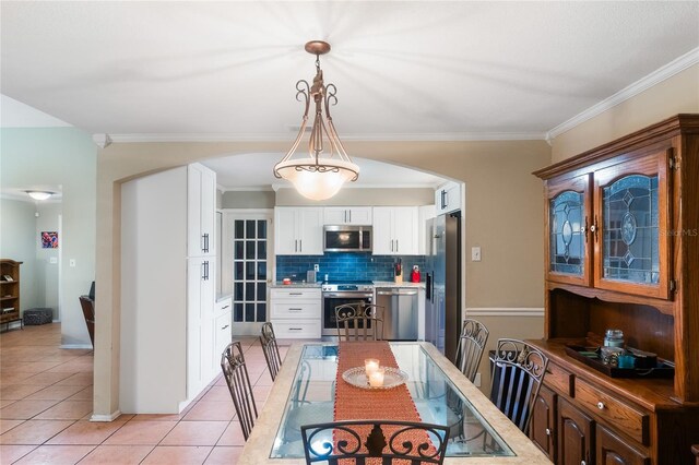1309 Paradise Ln, Winter Park, FL 32792 - dining area featuring crown molding and light tile patterned flooring