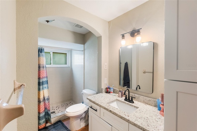 1309 Paradise Ln, Winter Park, FL 32792 - bathroom with vanity, toilet, and curtained shower