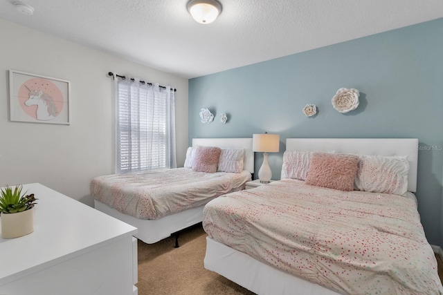 carpeted bedroom featuring a textured ceiling