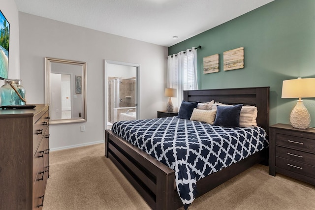 carpeted bedroom featuring connected bathroom