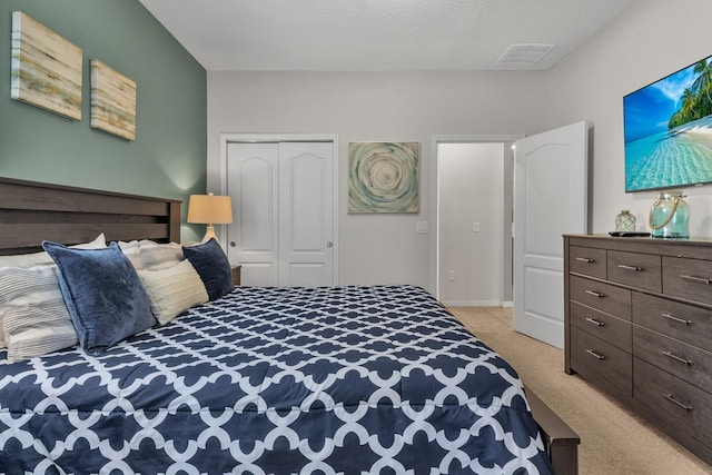 carpeted bedroom with a closet