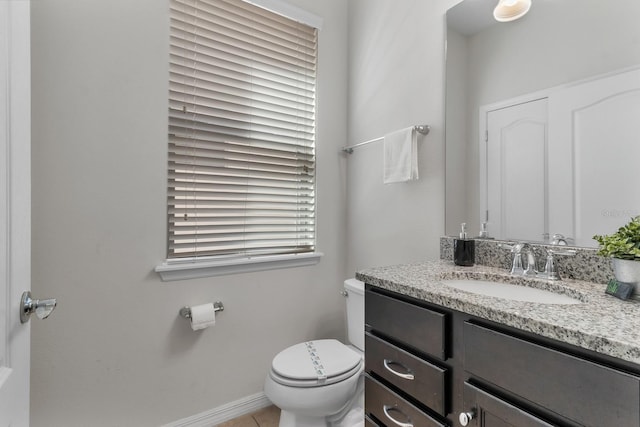 bathroom featuring toilet and vanity